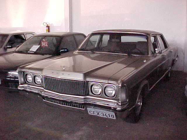 Brown 1970s Ford sedan front view with vertical grille and quad headlights. License plate CFX 3410