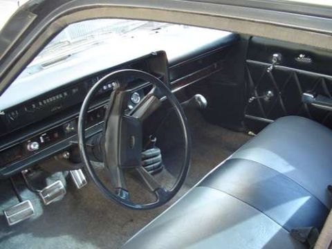 1972 Ford Ranchero - Interior view of a 1972 Ford Ranchero, showing the dashboard, steering wheel, and seats.
