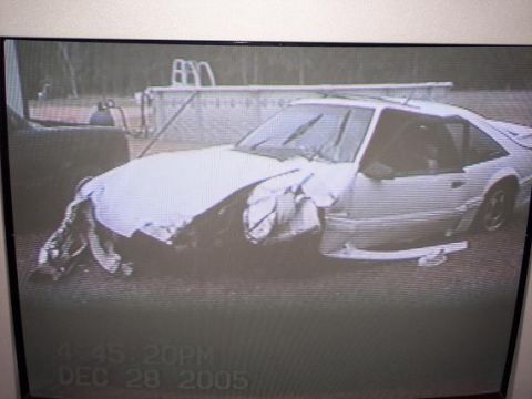 1977 Chevrolet Camaro - A white coupe sustained significant front-end damage, captured on camera in late 2005.