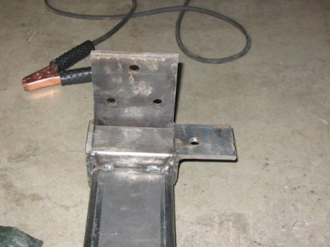 1995 Ford Bronco - Starting to fab a new E4OD crossmember...old one won't work since the cage radius arm attaches so far back on the frame, about where the st…
