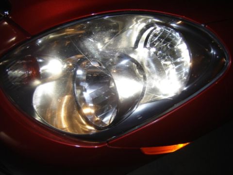 1999 Ford Taurus - The headlight assembly on this vehicle shows some wear and tear on the lens.