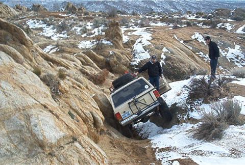 1986 Ford Bronco - Jake dents his xj. I think he was trying to lure me down this way. Um. No thanx. :)