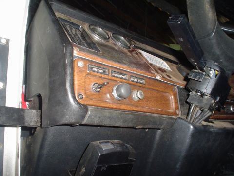 1966 International School Bus - Interior view of a vehicle's dashboard, various switches and gauges.