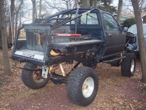 1995 Toyota Tacoma - Customized 1995 Toyota Tacoma pickup truck features a full roll cage and heavy-duty off-road suspension.