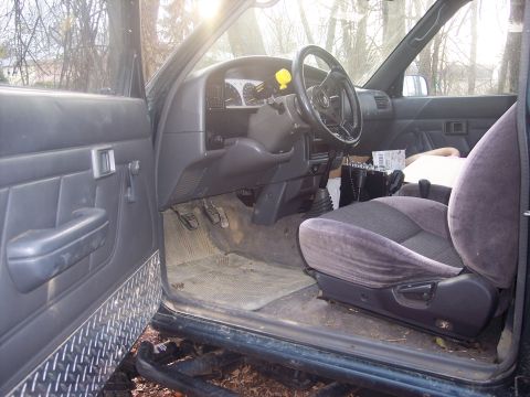 1995 Toyota Tacoma - Interior view of a 1995 Toyota Tacoma pickup truck, focusing on the driver's side.