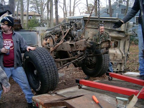 1986 Ford Sport - gettin the rollin chasis on the trailer to have the last of the parts removed then it can get scraped