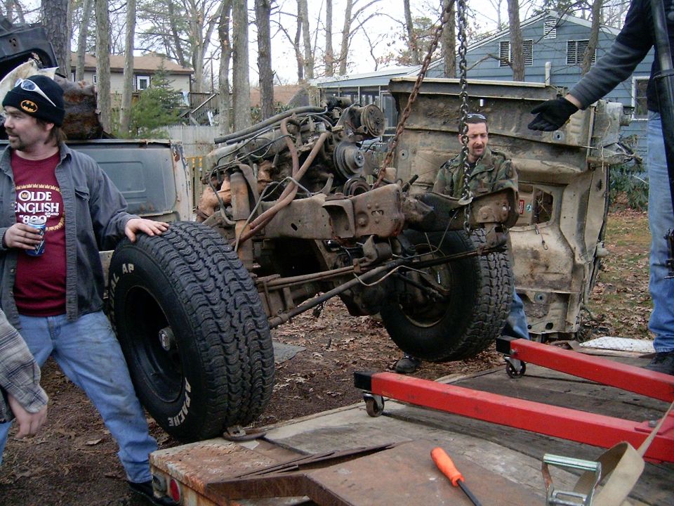 gettin the rollin chasis on the trailer to have the last of the parts removed then it can get scraped