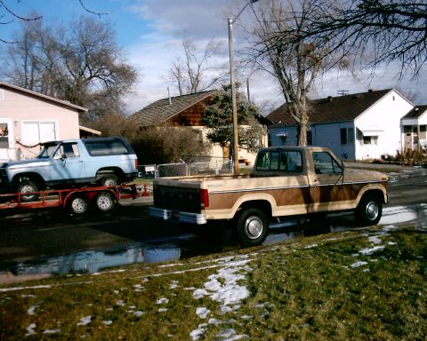 1985 Ford Bronco - 85 Blue Bronc in background of 85 3/4 ton pickup