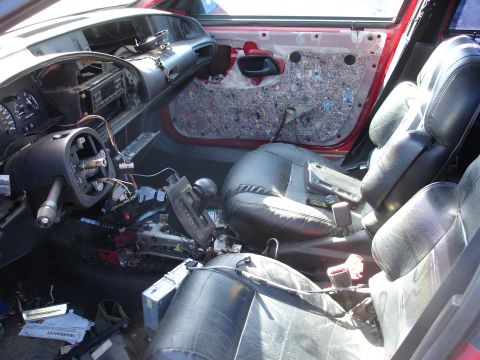 1993 Ford Taurus - Interior of a 1993 Ford Taurus showing disassembled dashboard and door panels.