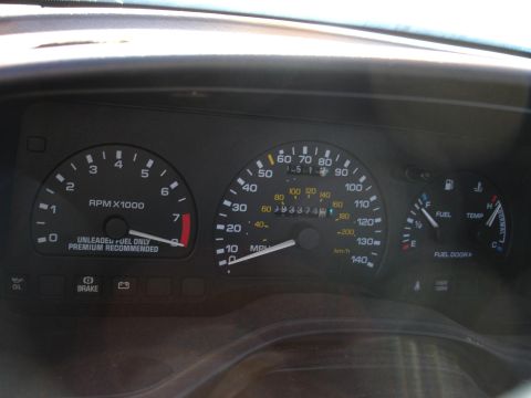 1993 Ford Taurus - The dashboard shows the vehicle's speed, RPM, fuel level, and temperature.