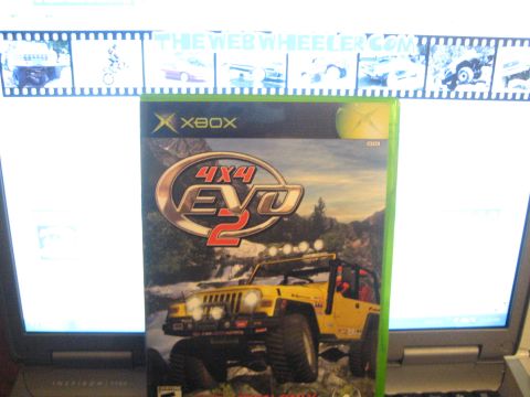 1985 Ford Mustang - Xbox 4x4 EVO 2 game case features a yellow Jeep on a rocky terrain.