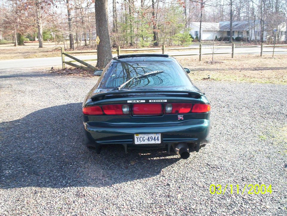 1997 Ford Probe rear view, dark green, with spoiler and custom exhaust