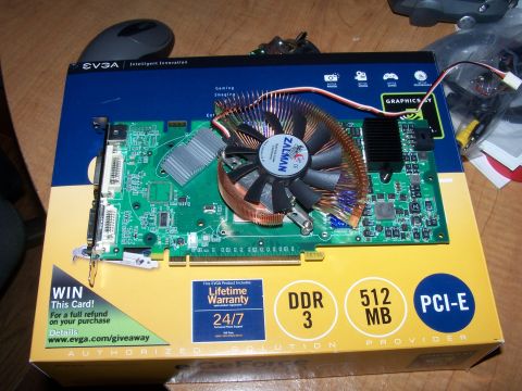 1979 Ford F-150 - A computer graphics card with a Zalman cooler sits on its EVGA packaging, which details DDR3 memory and PCI-E interface.
