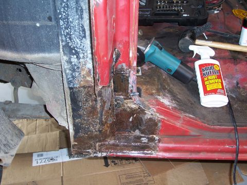 1978 Ford Bronco - Rust damage is evident on the vehicle's rocker panel, with tools laid out for repair.