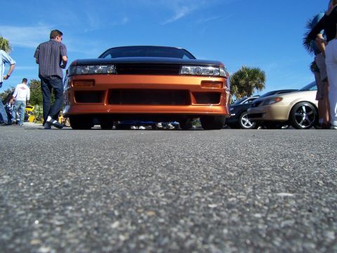 1994 Ford Probe - A low-angle shot of a custom Nissan 240SX S13 at a car meet.
