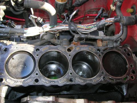 1992 Nissan 240SX - Close-up view of an engine block's cylinders and pistons, indicating potential mechanical issues.