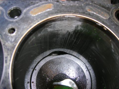 1992 Nissan 240SX - This engine cylinder shows significant damage, including deep scratches and a noticeable dent.