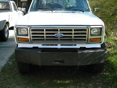 1986 Ford Bronco - Front view of a white Ford truck, possibly from the early 1980s, with a custom bumper installed.