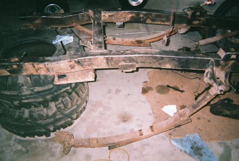 1967 Ford Bronco - Cutting off the rear springs for coils witch will be moved back about 5" inches.
