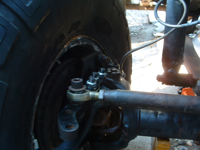 1994 Jeep YJ front wheel steering linkage with tie rod end and shock absorber