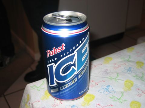 1985 Ford LTD Crown Victoria - A can of Pabst Blue Ribbon Ice beer sits on a table covered with a patterned cloth.
