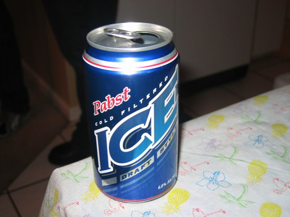 Pabst Blue Ribbon Ice beer can on a table with a floral pattern