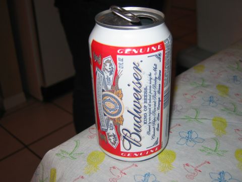 1985 Ford LTD Crown Victoria - A can of Budweiser beer sits open on a table covered with a colorful tablecloth.