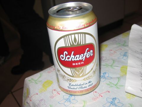 1985 Ford LTD Crown Victoria - A Schaefer beer can sits on a table covered with a colorful floral tablecloth. Text on the can indicates it was established in the United S…