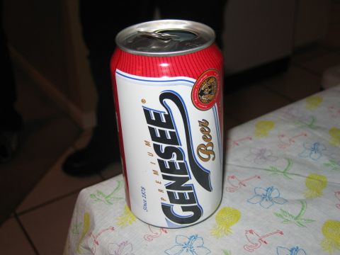 1985 Ford LTD Crown Victoria - A can of Genesee beer is shown on a table covered with a colorful floral patterned cloth.