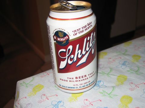 1985 Ford LTD Crown Victoria - A Schlitz beer can sits on a tablecloth with a tropical pattern.