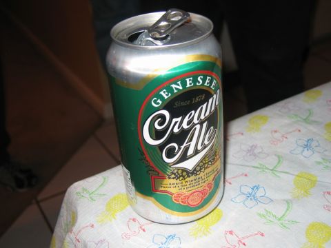 1985 Ford LTD Crown Victoria - A Genesee Cream Ale can is shown on a tablecloth with a tropical print.