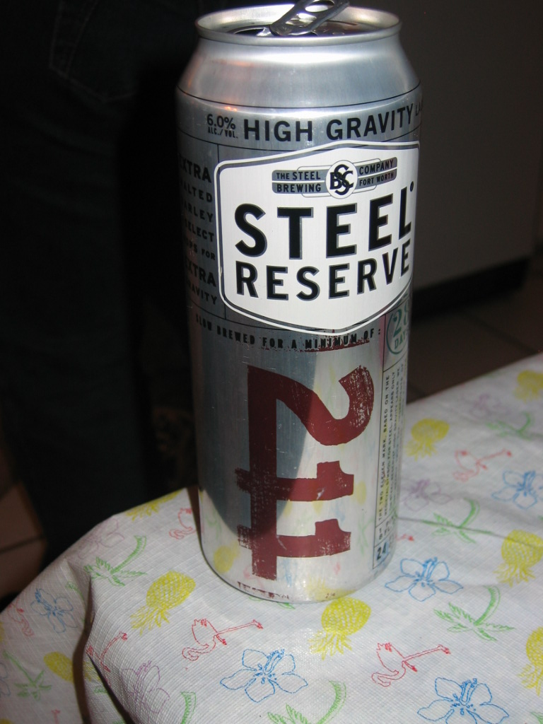 Steel Reserve High Gravity Lager can on a tablecloth with pineapple and flower print