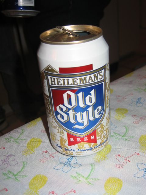 1985 Ford LTD Crown Victoria - A can of Old Style beer sits on a tablecloth with a tropical pattern.