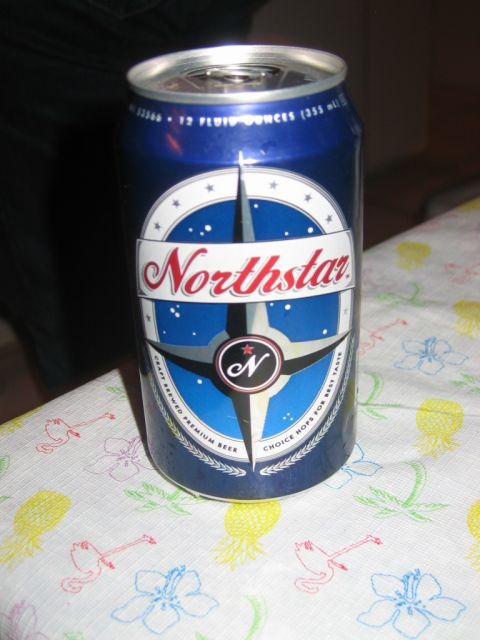 1985 Ford LTD Crown Victoria - A blue Northstar beer can sits on a tablecloth with a tropical print.
