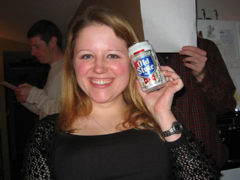 1985 Ford LTD Crown Victoria - A woman smiles while holding a beer can, with two men in the background.