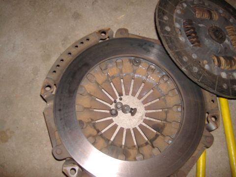 2004 Jeep Wrangler - Clutch pressure plate and disc assembly shown on a concrete surface with a SuperMotors logo in the corner.