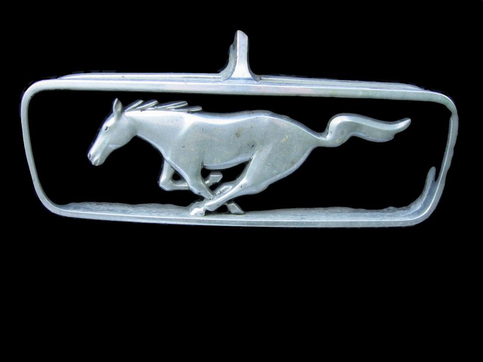 Chrome Ford Mustang running horse emblem in rectangular corral trim on black background