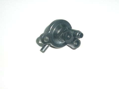 1900 Honda Big Red - A black plastic valve with multiple ports and mounting holes is shown against a white background.