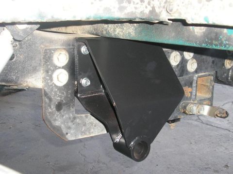1979 Chevrolet C/K Pickup - Close-up view of a trailer hitch mount assembly on a vehicle's undercarriage.