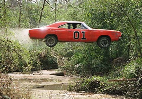 1996 Ford Probe - The iconic General Lee, a 1969 Dodge Charger, makes a daring jump over a muddy creek.