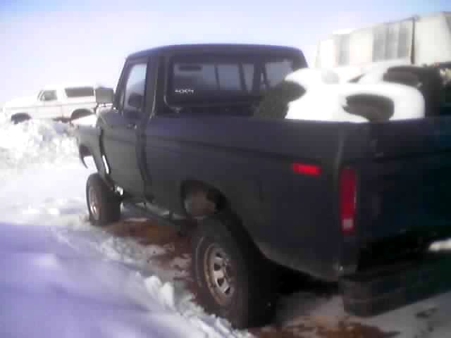 1979 Ford F-Series pickup truck in snow, another white SUV in background