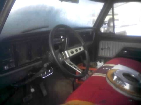 1979 Ford Bronco - The interior of a vehicle is shown, with a focus on the dashboard and steering wheel area.