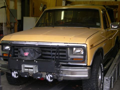 1982 Ford Bronco - This 1982 Ford Bronco features a prominent winch and KC lights mounted on its front bumper.