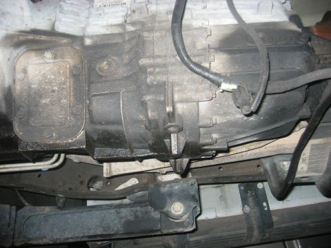 1989 Ford Bronco - Underside view of vehicle transmission and frame components, with Supermotors.net logo.