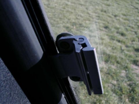 1984 Ford Bronco - Detail of a windshield wiper arm mount, showing its mechanical connection.