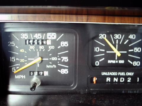 1984 Ford Bronco - The dashboard gauges show a speed of 55 MPH and an odometer reading of 027.