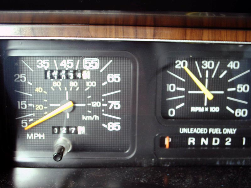 Dashboard gauges with a speedometer reading 55 MPH and a tachometer reading 2000 RPM. Odometer shows 027
