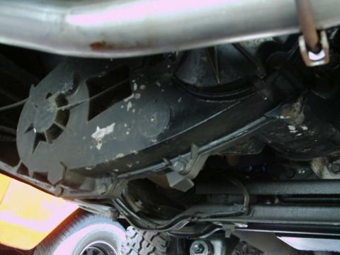 1984 Ford Bronco - Undercarriage view reveals transmission and exhaust system components.