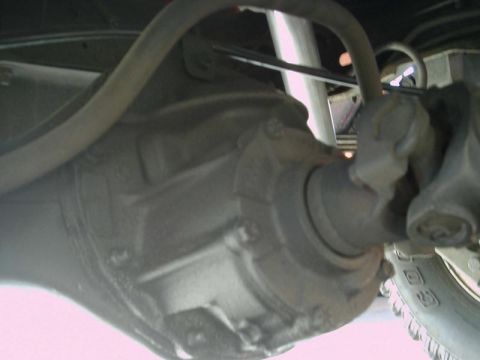 1984 Ford Bronco - Close-up view of a vehicle's rear axle and driveshaft components.