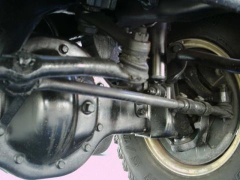 1984 Ford Bronco - Front axle and steering components are visible in this close-up shot.